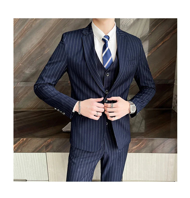 New three-piece suit with tailored striped business suit blazer and trousers set. Korean fashion trend. Stylish wedding attire.