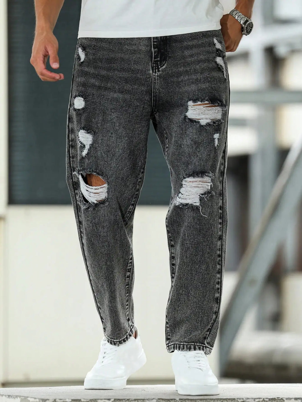 Men's ripped jeans for spring and autumn, dark gray harem pants. Street style. Casual trend.