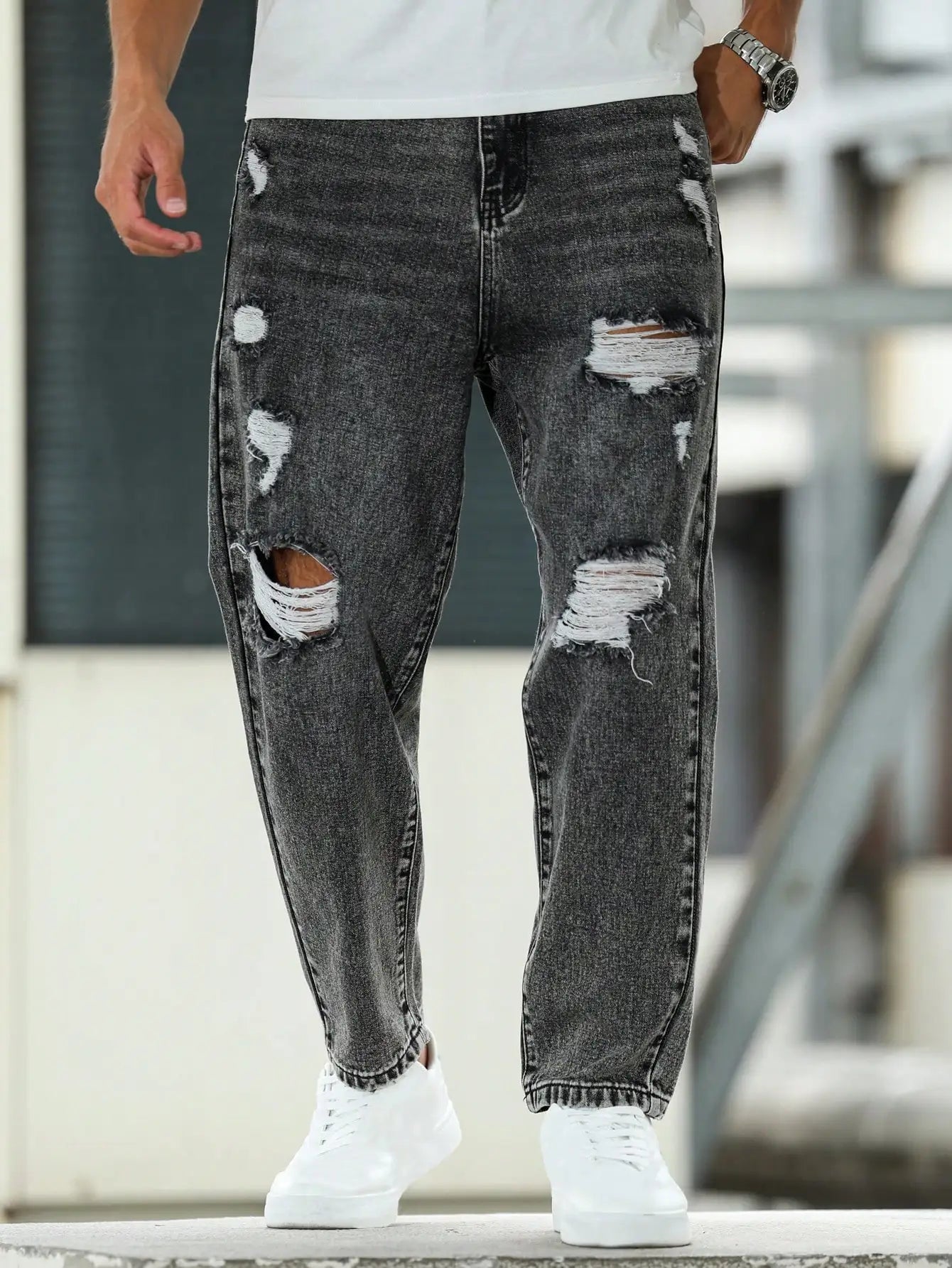 Men's ripped jeans for spring and autumn, dark gray harem pants. Street style. Casual trend.