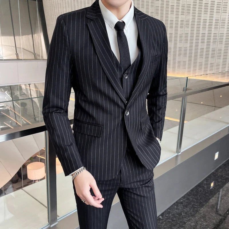 New three-piece suit with tailored striped business suit blazer and trousers set. Korean fashion trend. Stylish wedding attire.