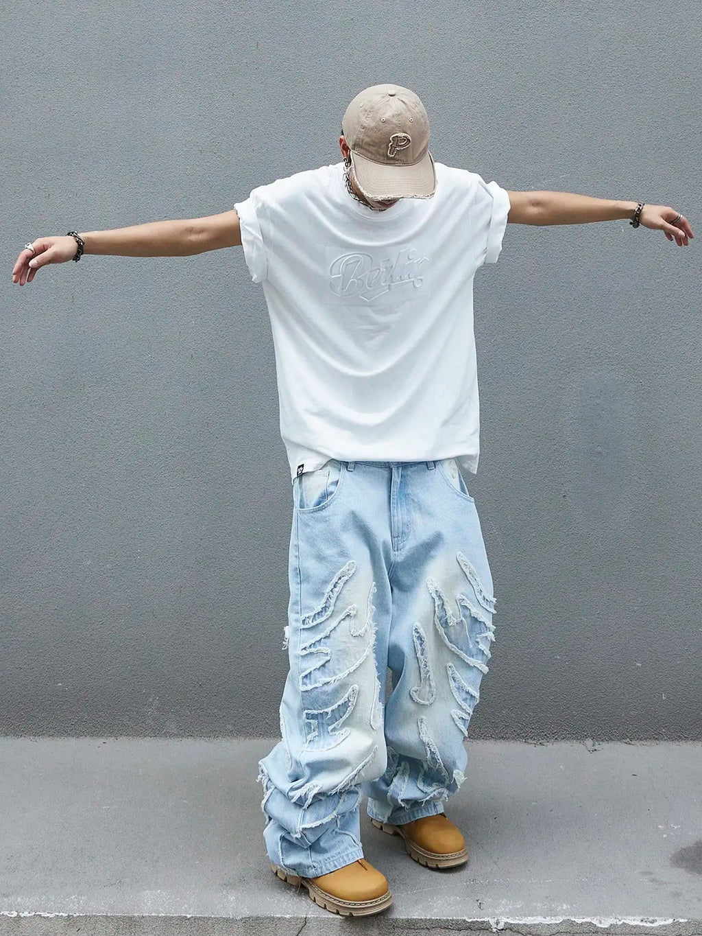 Men's trendy and cool denim wide-leg pants for all seasons featuring unique patchwork patterns, light blue street-stunning style