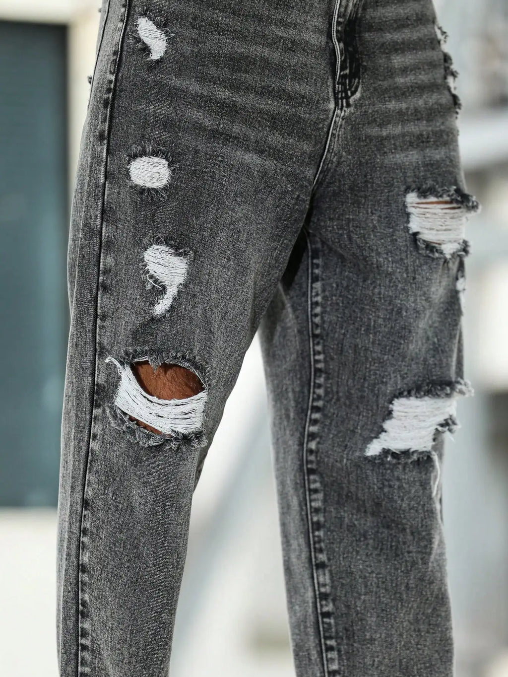 Men's ripped jeans for spring and autumn, dark gray harem pants. Street style. Casual trend.