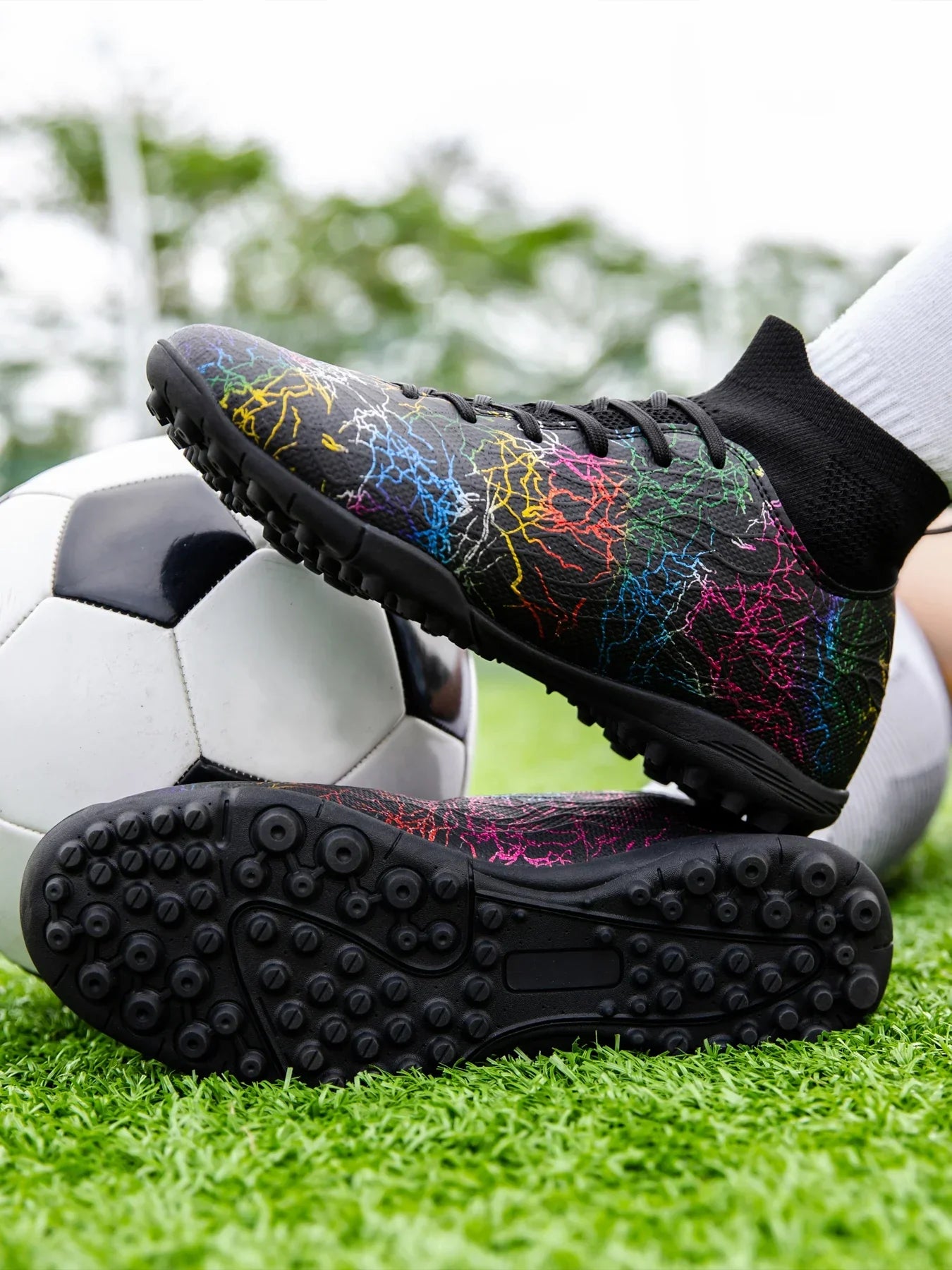 High quality, high-top football shoes, unisex style, comfortable, breathable, available in TF and FG options.  Sole spikes