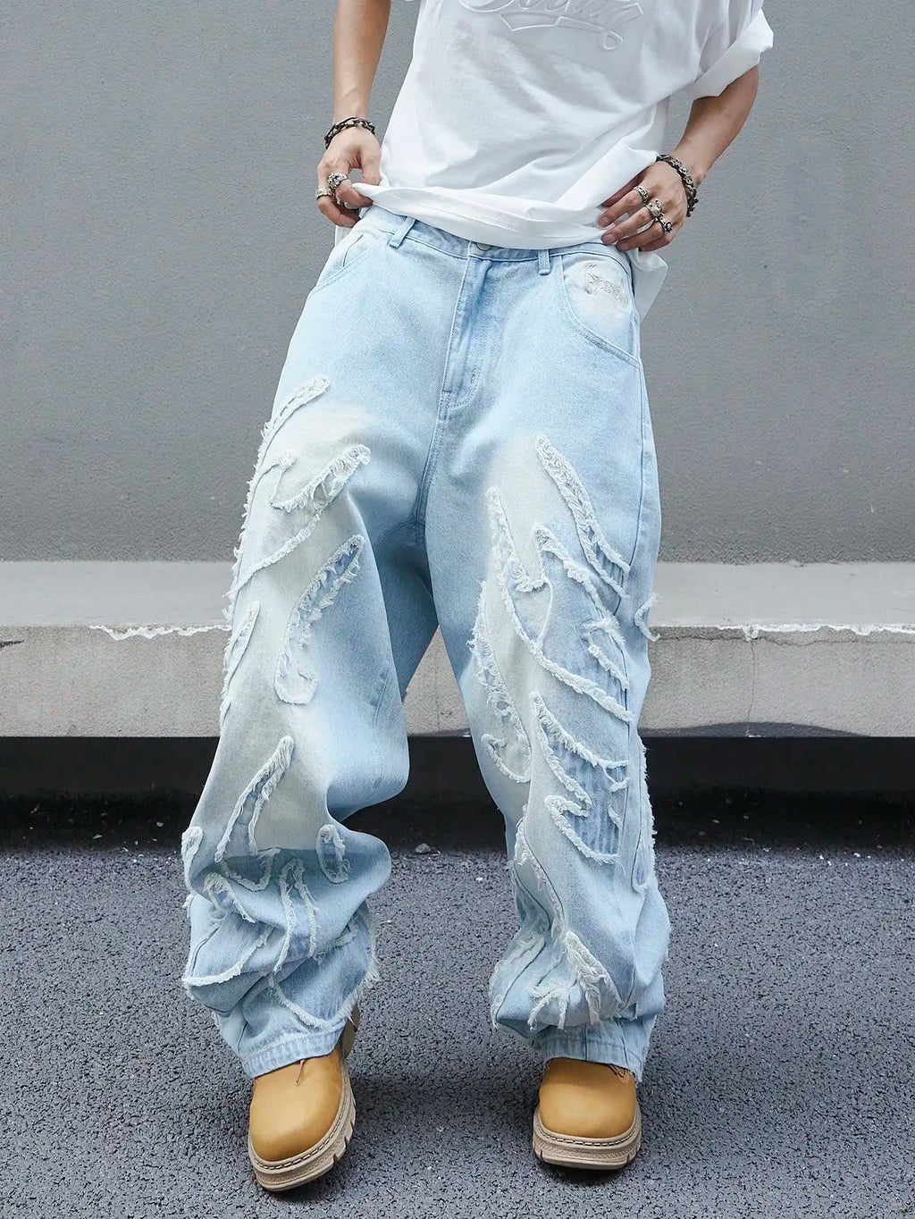 Men's trendy and cool denim wide-leg pants for all seasons featuring unique patchwork patterns, light blue street-stunning style